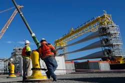 A generator and its blades are prepared for the South Fork Wind farm, State Pier, New London, Conn., Dec. 4, 2023.