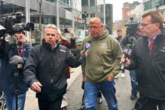 Massachusetts State Police Sgt. Gary Cederquist, center, leaves federal court in Boston, Jan 30, 2024.