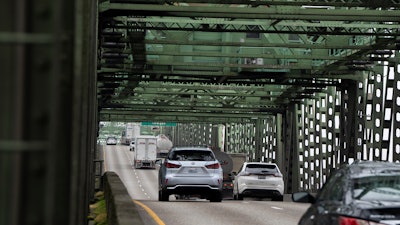 Traffic moves along the Interstate 5 bridge between Portland, Ore., and Vancouver, Wash., Feb. 13, 2024.