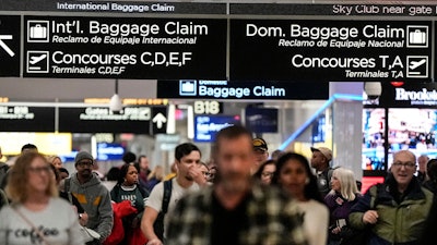 Travelers move through the B terminal at Hartsfield-Jackson Atlanta International Airport, Jan. 27, 2024.
