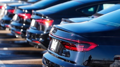 Unsold 2023 sedans sit in a long row at an Audi dealership Sunday, Feb. 11, 2024, in Broomfield, Colo. On Tuesday, the Labor Department issues its report on inflation at the consumer level in January.