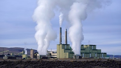 Steam billows from a coal-fired power plant in Craig, Colo., Nov. 18, 2021.