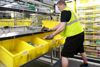 Merchandise is scanned to be tracked as it moves through the new Amazon Fulfillment Center in Sacramento, Calif., on Feb. 9, 2018.