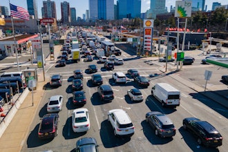 Commuters wait to drive through the Holland Tunnel into New York City, Jersey City, N.J., March 8, 2023.