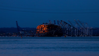 Wreckage of the Francis Scott Key Bridge rests on the container ship Dali, Baltimore, March 31, 2024.