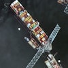 Satellite image showing the bow of the container ship Dali underneath sections of the fallen Francis Scott Key Bridge, Baltimore, April 8, 2024.