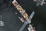 Satellite image showing the bow of the container ship Dali underneath sections of the fallen Francis Scott Key Bridge, Baltimore, April 8, 2024.
