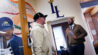 Ron Waddell, founder and executive director of Legendary Legacies, right, talks with Gary Goyette, Worcester, Mass., April 19, 2024.