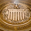 In this Feb. 5, 2018, file photo, the seal of the Board of Governors of the United States Federal Reserve System is displayed in the ground at the Marriner S. Eccles Federal Reserve Board Building in Washington.