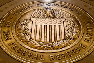 In this Feb. 5, 2018, file photo, the seal of the Board of Governors of the United States Federal Reserve System is displayed in the ground at the Marriner S. Eccles Federal Reserve Board Building in Washington.