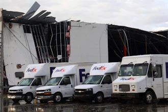 FedEx trucks outside a damaged FedEx facility in Portage, Mich., May 7, 2024.