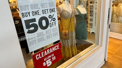 Signs in a clothing store in Lone Tree, Colo., April 29, 2024.