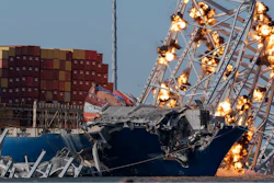 Explosive charges are detonated to bring down sections of the collapsed Francis Scott Key Bridge resting on the container ship Dali on Monday, May 13, 2024, in Baltimore.