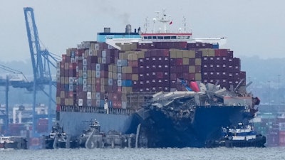 Crews work to move the cargo ship Dali in Baltimore, Monday, May 20, 2024.