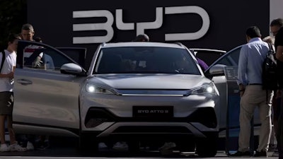 Visitors check out a BYD ATTO 3 at the Munich auto show in 2023.