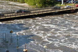 Water flows dangerously under the Falls Park Drive bridge at Falls Park, Sioux Falls, S.D., June 22, 2024.