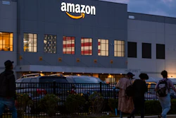 People arrive for work at an Amazon distribution center in Staten Island, New York, Oct. 25, 2021.