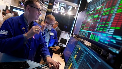 Specialist Patrick King, left, on the floor of the New York Stock Exchange, Aug. 6, 2024.