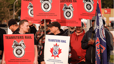 Teamsters Canada Rail Conference members picket outside the CPKC headquarters Calgary, Alta., Aug. 23, 2024.