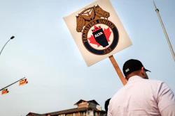 Teamsters Canada Rail Conference members picket outside the CPKC headquarters in Calgary, Alta.