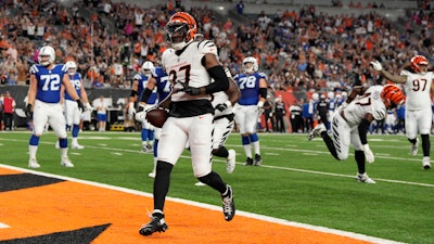 Cincinnati Bengals safety Jordan Battle returns an interception for a touchdown during the first half of a preseason NFL football game against the Indianapolis Colts, Aug. 22, 2024, Cincinnati.