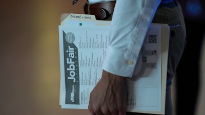 A person in a line at a job fair in Sunrise, Fla., Aug. 29, 2024.