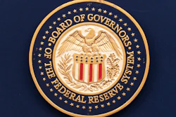 The seal of the Federal Reserve System shows at a news conference in Washington, July 31, 2024.