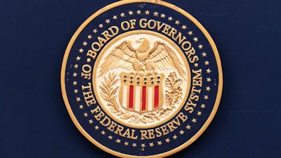 The seal of the Federal Reserve System shows at a news conference in Washington, July 31, 2024.
