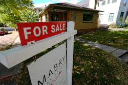 A sale sign stands outside a home in the east Washington Park neighborhood of Denver, Oct. 17, 2024.