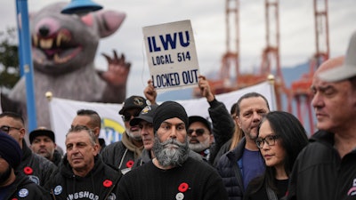 NDP Leader Jagmeet Singh, front center, and MP Jenny Kwan, front second right, at a rally with locked out port workers, Vancouver, British Columbia, Nov. 8, 2024.
