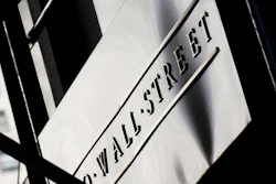 Sign for Wall Street outside the New York Stock Exchange, July 15, 2013.
