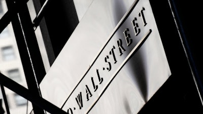 Sign for Wall Street outside the New York Stock Exchange, July 15, 2013.