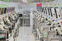 A man works at a manufacturer of Integrated Chip encapsulation in Nantong in eastern China's Jiangsu province on Friday, Sept. 16, 2022.