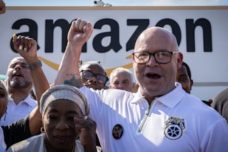 Teamsters General President Sean M. O'Brien, center, rallies with Amazon workers outside the Staten Island Amazon facility JFK8, June 19, 2024, New York.
