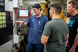 Jason Zenger and Nick Goellner speak with a machinist about his CNC machining processes.