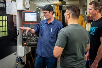 Jason Zenger and Nick Goellner speak with a machinist about his CNC machining processes.