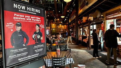 Hiring sign at a restaurant in Skokie, Ill., Jan. 8, 2025.