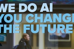 A woman is reflected in a window with a slogan about AI ahead of the World Economy Forum in Davos, Switzerland,, Jan. 19, 2025.