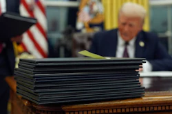 President Donald Trump signs executive orders in the Oval Office of the White House, Monday, Jan. 20, 2025, in Washington.