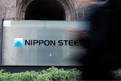 A person walks past a Nippon Steel Corporation sign at the company headquarters Tuesday, Jan. 7, 2025, in Tokyo.