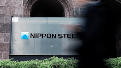 A person walks past a Nippon Steel Corporation sign at the company headquarters Tuesday, Jan. 7, 2025, in Tokyo.