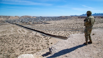A U.S. Army soldier looks at the wall along U.S.-Mexico border, Sunland Park, N.M., Feb. 3, 2025.