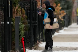 An Amazon delivery man delivers a package, Chicago, Jan. 8, 2025.