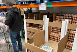 A consumer places a flat of eggs in a shopping cart in a Costco warehouse Tuesday, Feb. 18, 2025, in Sheridan, Colo.