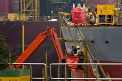 Workers construct the hull of a vessel at the STX shipbuilding plant on Changxing Island, on the outskirt of Dalian, in northeast China's Liaoning province, Sept. 15, 2011.