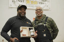 Matthew Bracey (left), Construction Trades Masonry Program manager at Randolph Career and Technical Center in Detroit, and Carhartt SVP of Inclusion, Sustainability and Community Todd Corley.