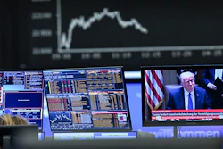 A television monitor showing U.S. President Donald Trump in front of a display board with the Dax curve, Frankfurt, Germany, April 3, 2025.