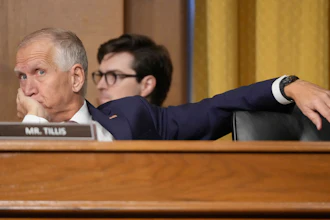Sen. Thom Tillis, R-N.C., listens as U.S. Trade Representative Jamieson Greer testifies before the Senate Finance Committee, Washington, April 8, 2025.
