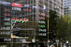 An electronic board displays Shanghai shares trading index in the Central Business District, Beijing, April 9, 2025.