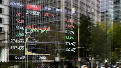 An electronic board displays Shanghai shares trading index in the Central Business District, Beijing, April 9, 2025.